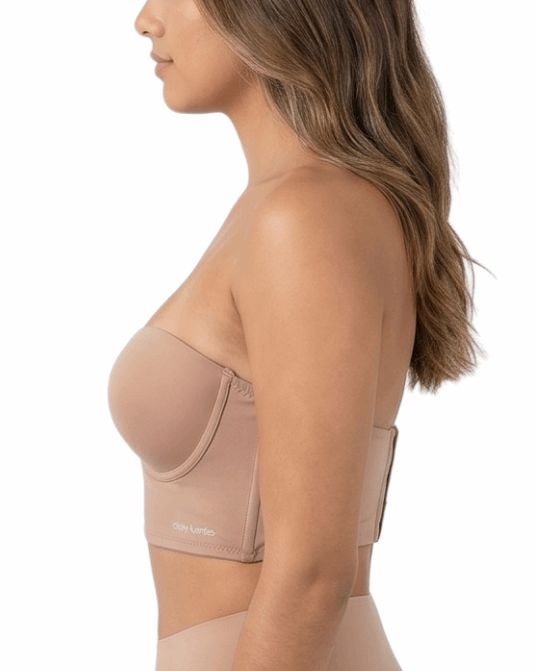 Woman wearing a beige longline bra on a white background