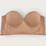 Beige strapless bra on a white background