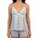 Woman wearing a gray lace camisole and shorts set on a white background
