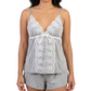 Woman wearing a gray lace camisole and shorts set on a white background