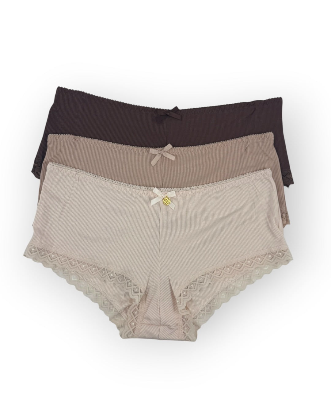 Three pairs of women's underwear, one brown, one mocha, and one beige, on a white background.