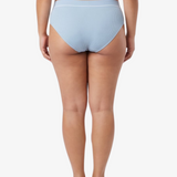 A woman modeling a pair of light blue bikinis against a plain white studio background. 