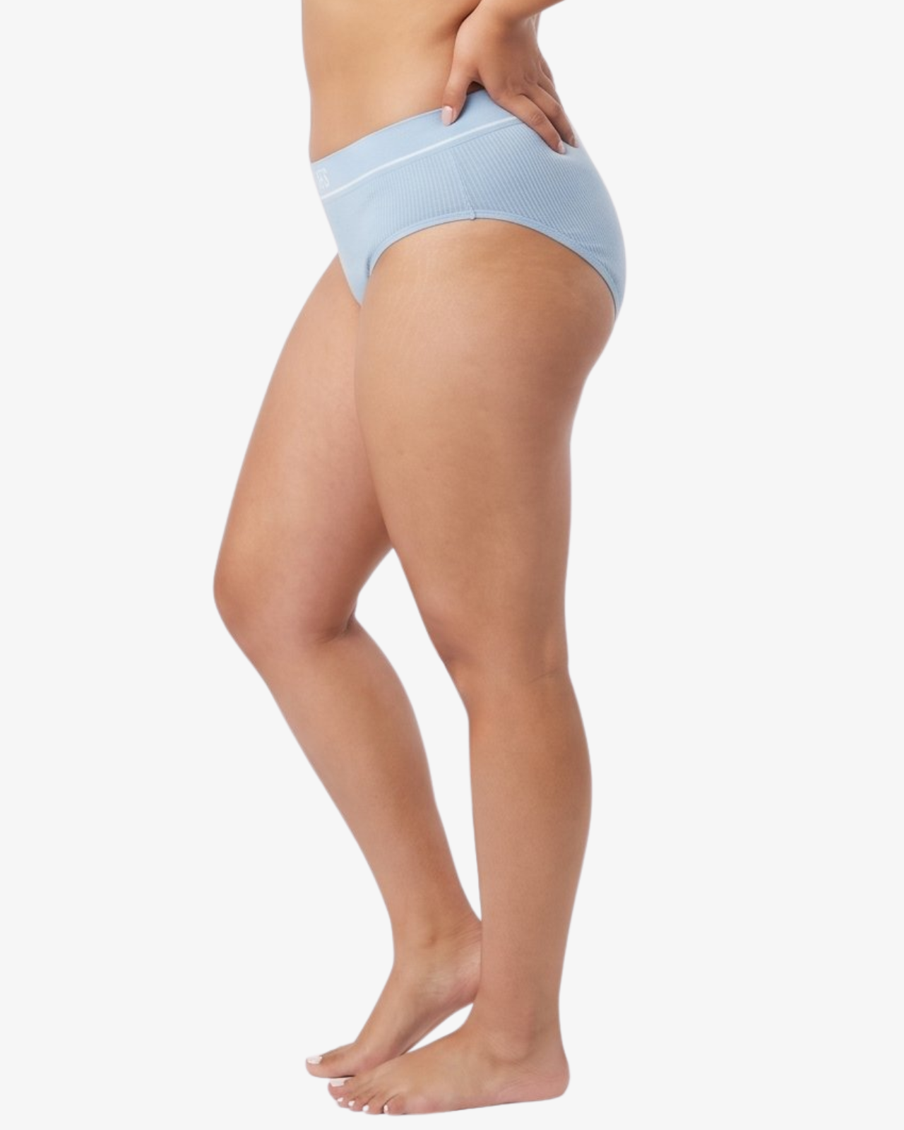 A woman modeling a pair of light blue bikinis against a plain white studio background. 