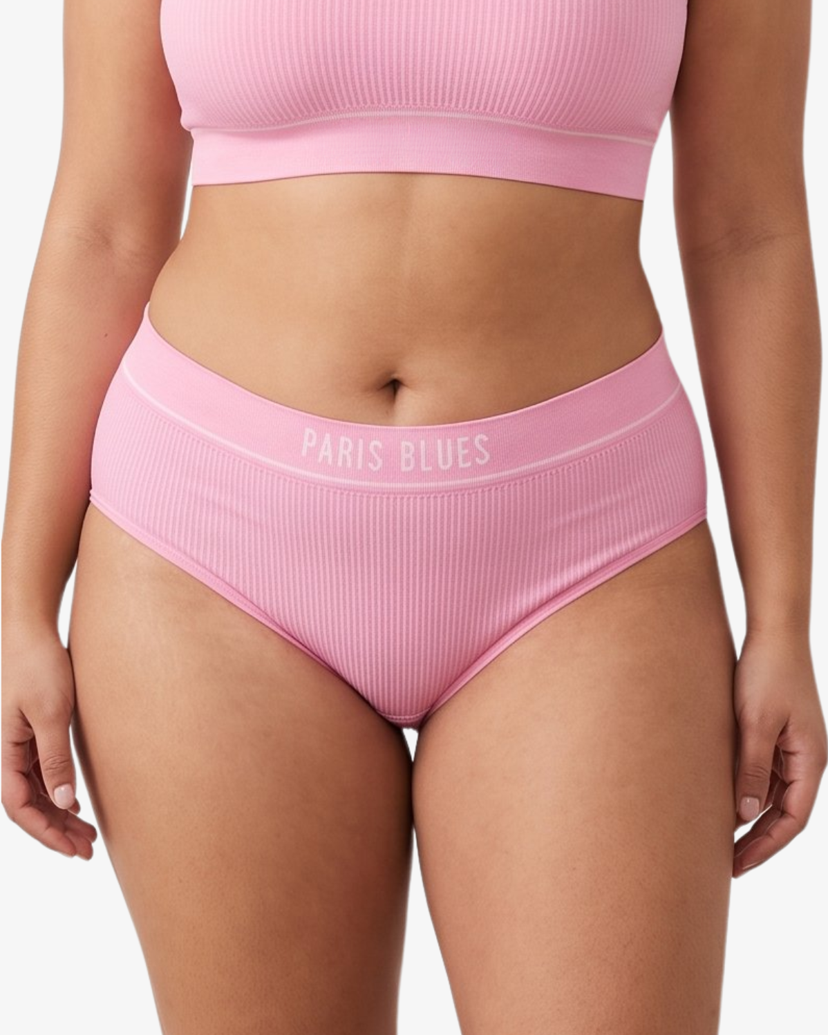 A woman modeling a ribbed high-waisted bikini with 'PARIS BLUES' printed on the waistband, against a light gray studio background.