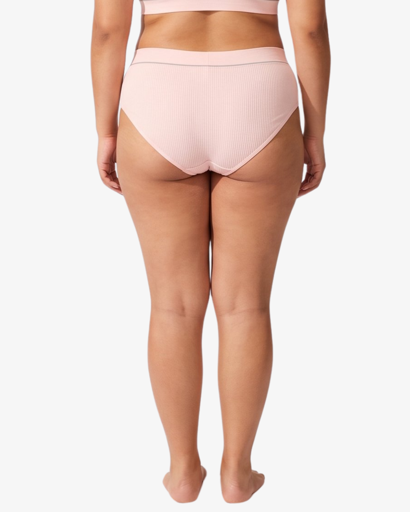 A model wearing a light pink ribbed high-waisted bikinis, featuring the brand name 'PARIS BLUES' printed on the waistbands, against a light gray background.