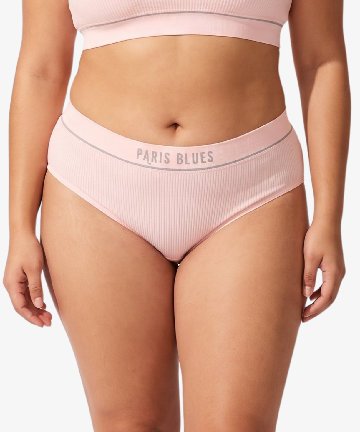 A model wearing a light pink ribbed high-waisted bikinis, featuring the brand name 'PARIS BLUES' printed on the waistbands, against a light gray background.