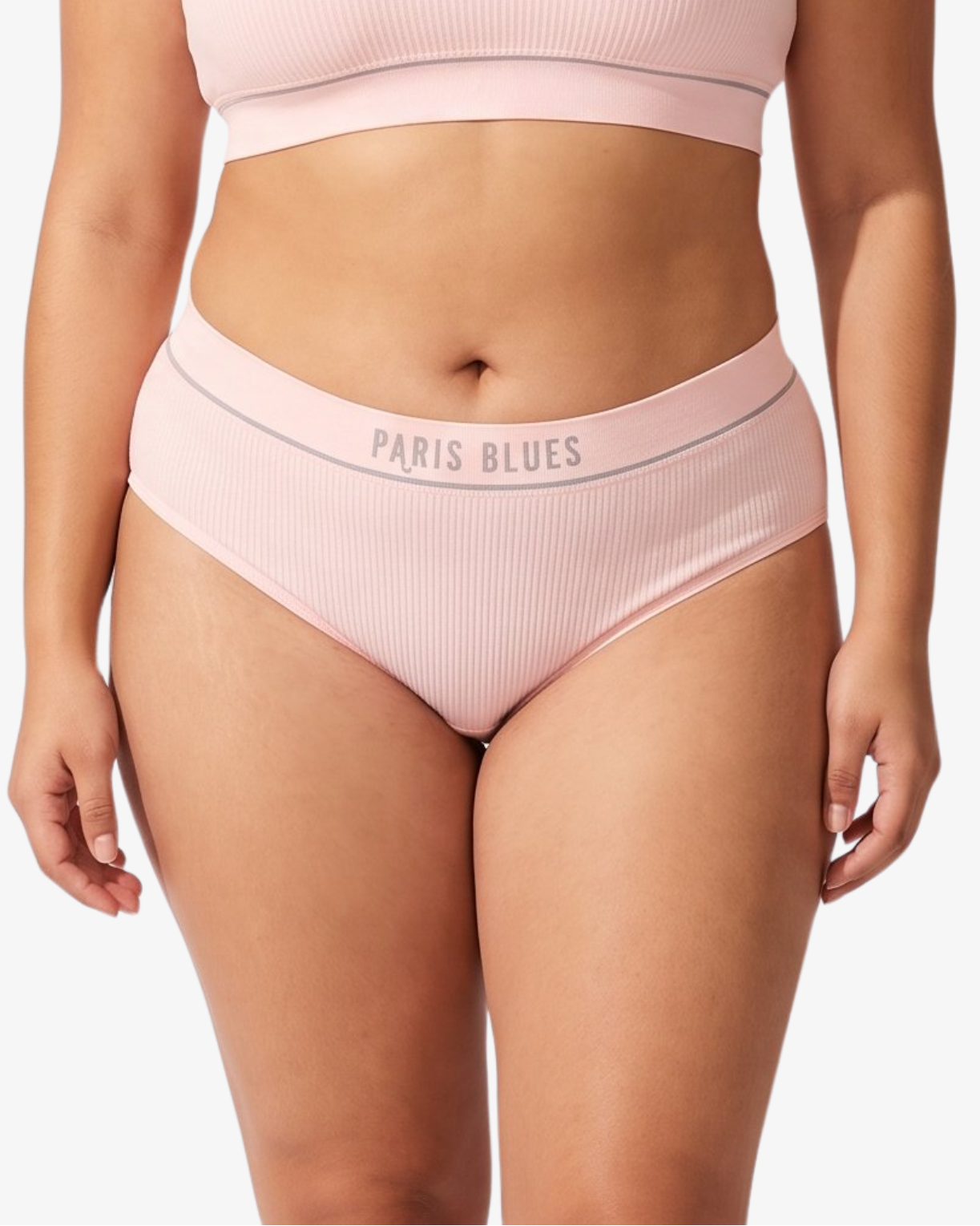 A model wearing a light pink ribbed high-waisted bikinis, featuring the brand name 'PARIS BLUES' printed on the waistbands, against a light gray background.