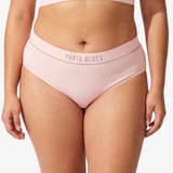 A model wearing a light pink ribbed high-waisted bikinis, featuring the brand name 'PARIS BLUES' printed on the waistbands, against a light gray background.