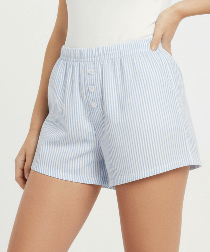 Light blue striped shorts worn by a person on a white background