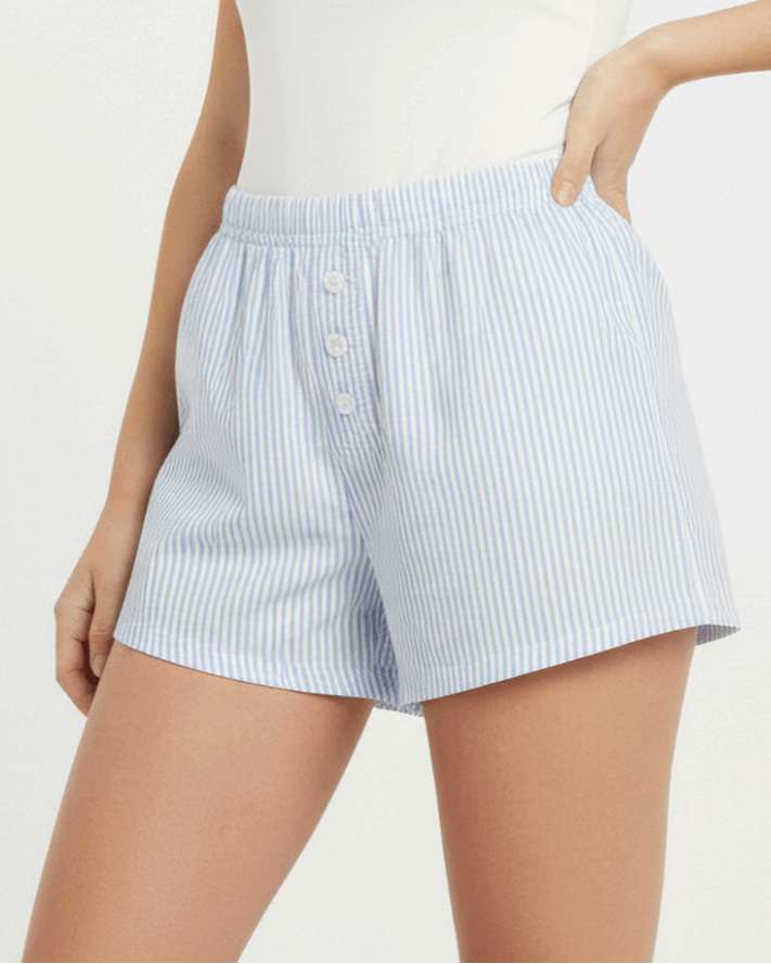 Light blue striped shorts worn by a person on a white background