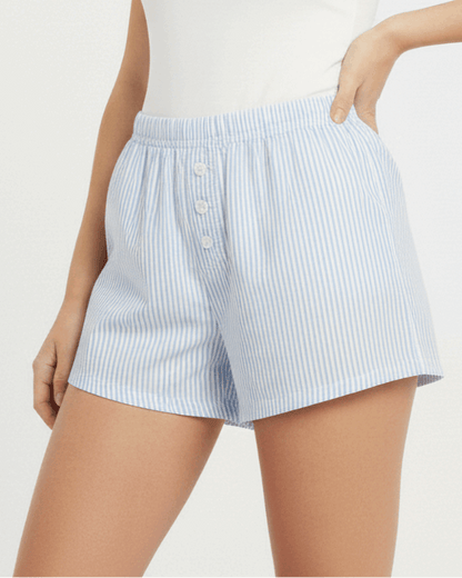 Light blue striped shorts worn by a person on a white background