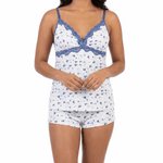 Woman wearing a white and blue patterned pajama set on a white background