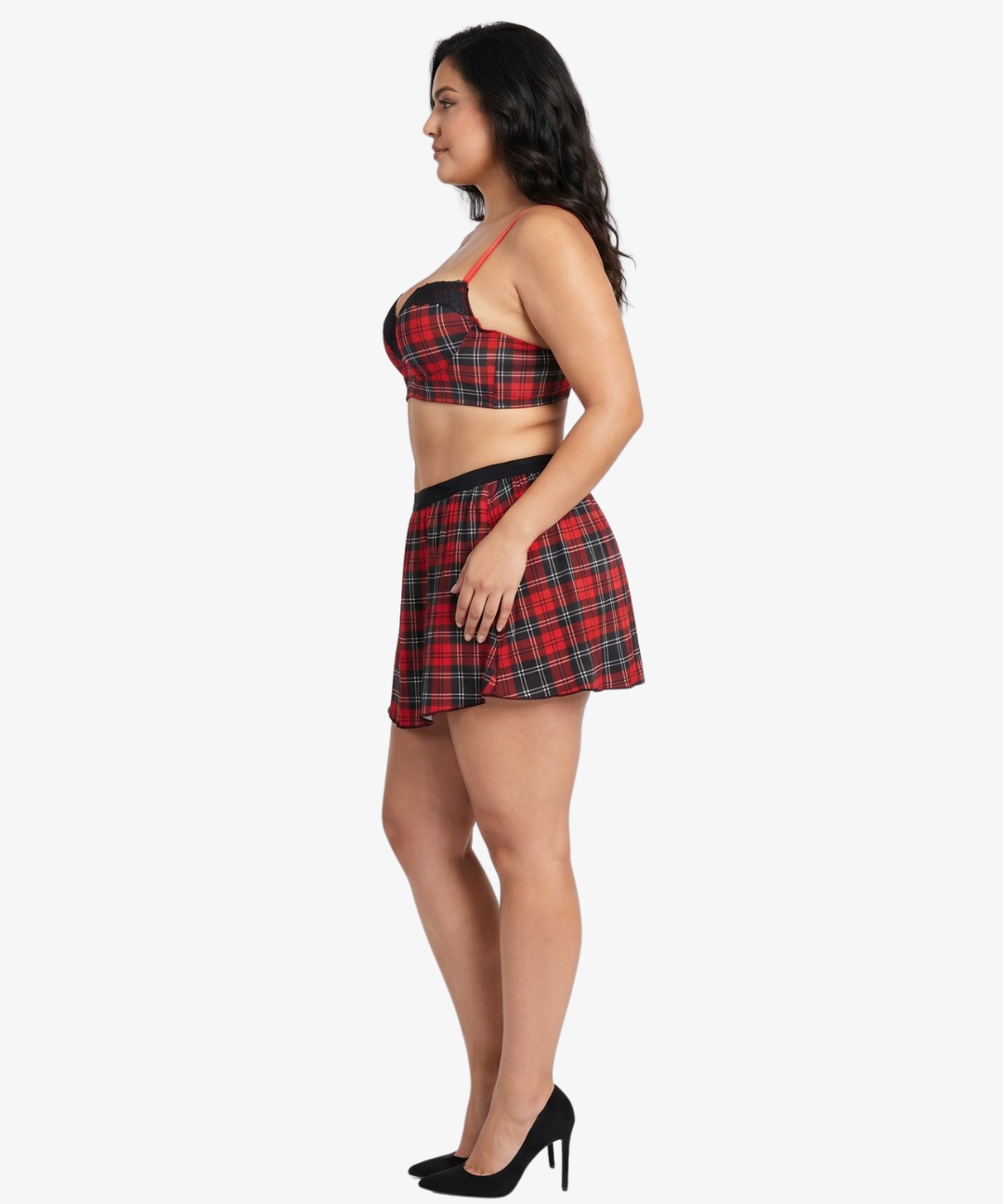 Plus size woman wearing a red and black plaid top and skirt on a white background