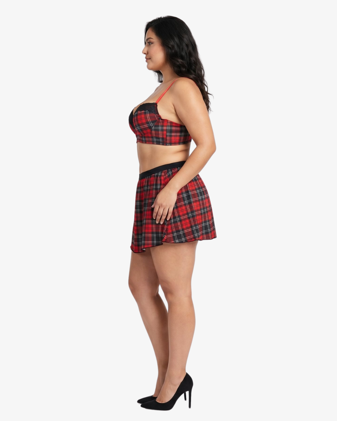 Plus size woman wearing a red and black plaid top and skirt on a white background