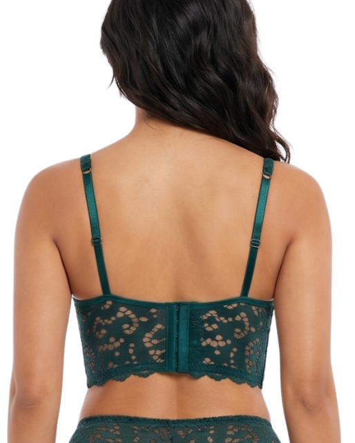 Woman wearing a green lace bra on a white background