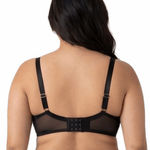 Woman wearing a black lace bra on a white background
