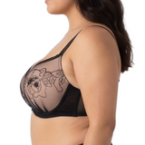 Woman wearing a black lace bra on a white background