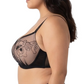 Woman wearing a black lace bra on a white background