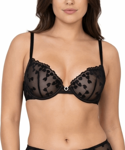 Woman wearing a black lace bra on a white background
