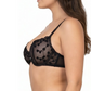 Woman wearing a black lace bra on a white background