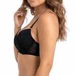 Woman wearing a black lace bra on a white background
