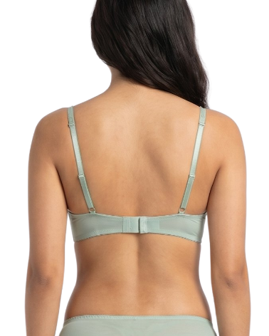 Woman wearing a light green bra on a white background
