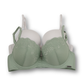 Green bra with lace details and solid white bra on a white background
