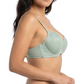 Woman wearing a light green bra on a white background