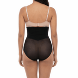 Woman wearing a black shapewear on a white background