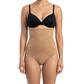 Woman wearing a black bra and mocha shapewear on a white background