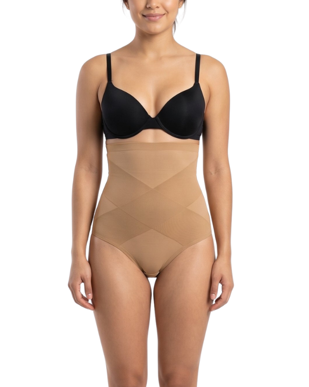 Woman wearing a black bra and mocha shapewear on a white background