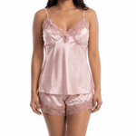 Woman wearing a pink satin nightgown on a white background