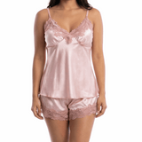 Woman wearing a pink satin nightgown on a white background
